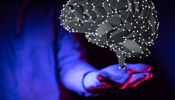 istock 3D rendering of a hand holding an illustrated gray structure of a brain 1455201160