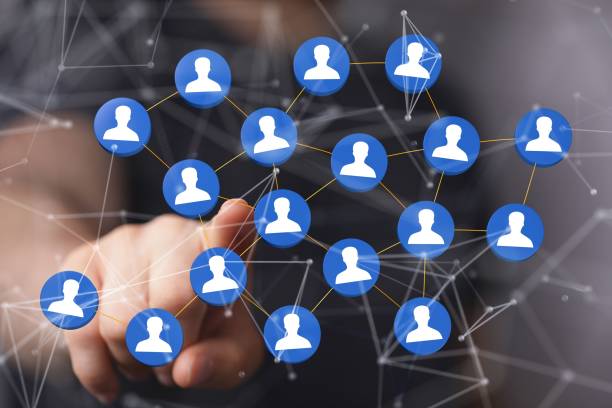 istock Person presenting a virtual projection of human network 1455201929