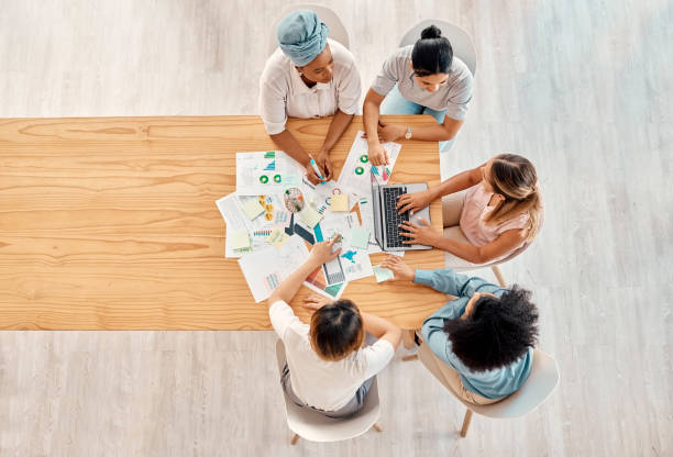 istock Finance, business meeting and collaboration with business people working on planning, documents and accounting chart from above. Accounting, team and financial paper, logistics and and data strategy 1455203504