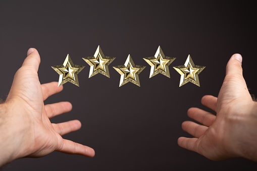 A 3d rendering of a review icon and rating stars showing a feedback levitating above a person's hands
