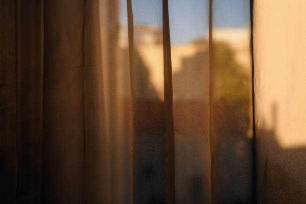 istock Yellow curtains in living room as home decor 1455205025
