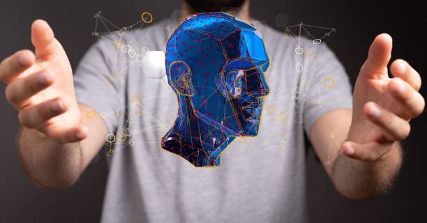 istock Man showing a 3D rendering of a human head construction. The concept of an artificial intelligence 1455205501