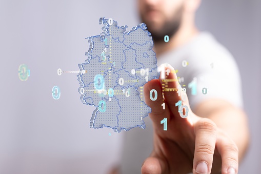A man pointing the 3D rendered Germany map network, internet and global connection