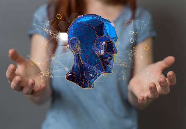 istock Woman's hands with digital 3D rendering of a human head - concept of artificial intelligence 1455205641