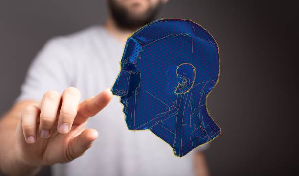 istock Man with digital 3D rendering of a human head - concept of artificial intelligence 1455205652