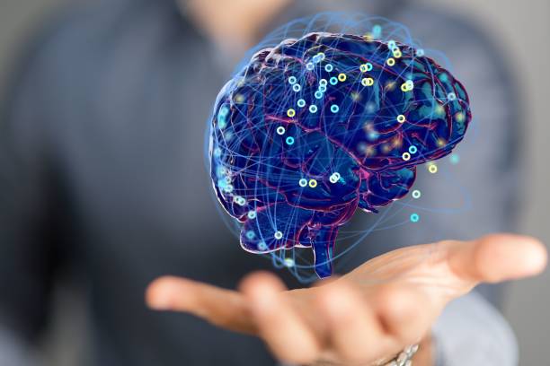 istock Person presenting a 3D render of human brain - IQ testing and artificial intelligence concept 1455205729