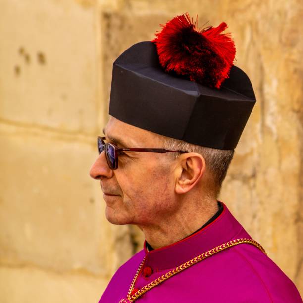 Monsignor 2 wearing biretum Zejtun, Malta – April 20, 2022: Monsignor of the Mdina Metropolitan Cathedral wearing birretum monsignor stock pictures, royalty-free photos & images