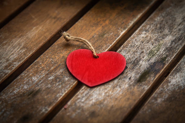 istock heart label on wooden background 1455206532