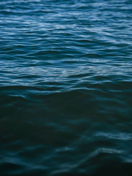 istock Vertical closeup of the blue sea pattern. 1455206679