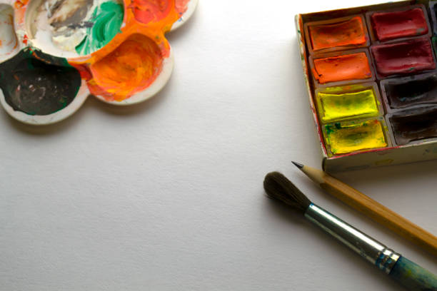 istock Drawing supplies on white paper. 1455207261