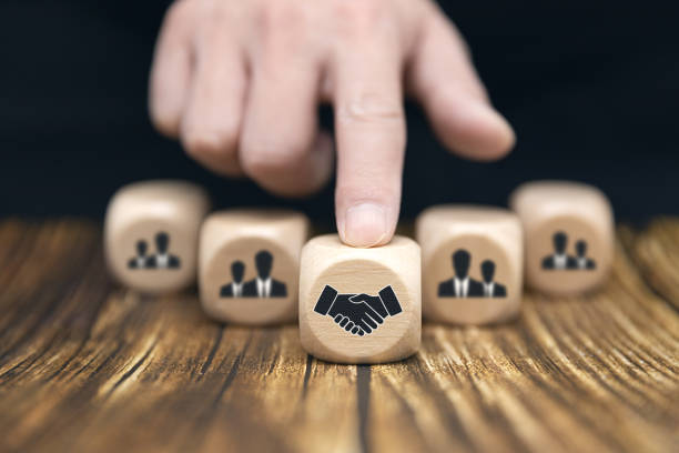 istock work together with one's team members toward one's goal 1455207398