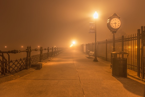 A street clock in Louisville reservoir on a foggy morning