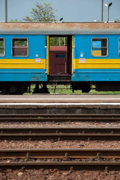 istock Abandoned blue and yellow train carriage and railway tracks 1455207957
