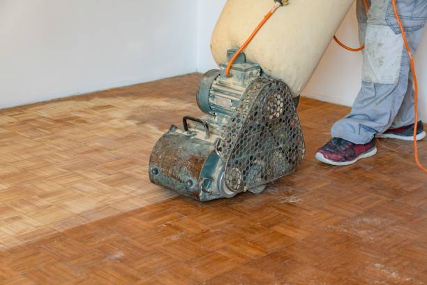 istock Worker changing sanding paper on a grinding machine in a domestic room 1455208880