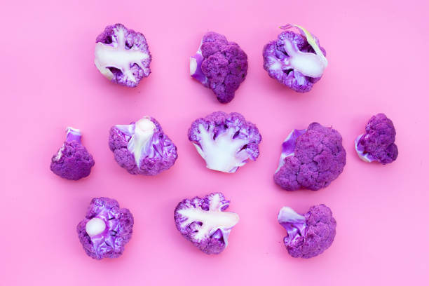 istock Purple cauliflower on pink background. 1455210097