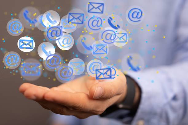 istock Hologram of a 3D rendered messages symbols with a person behind explaining communication topics 1455210575