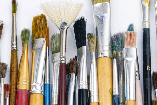 istock Close-up, old paint brushes on a white background. 1455211269