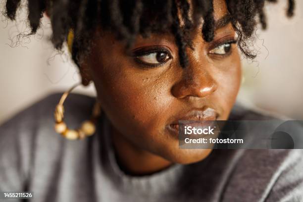 Young Woman Looking Away Contemplating Her New Years Resolutions Stock Photo - Download Image Now