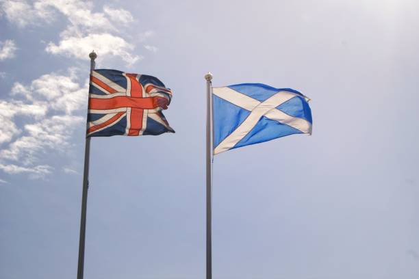 istock Scottish and British flags waving in the wind 1455212904
