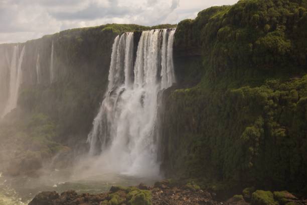 istock Beautiful landscape of a waterfall on a cloudy day 1455214449