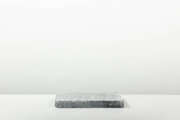 istock Stone podium for packaging and cosmetic presentation. Monochrome gray template for mockup, banner 1455215886
