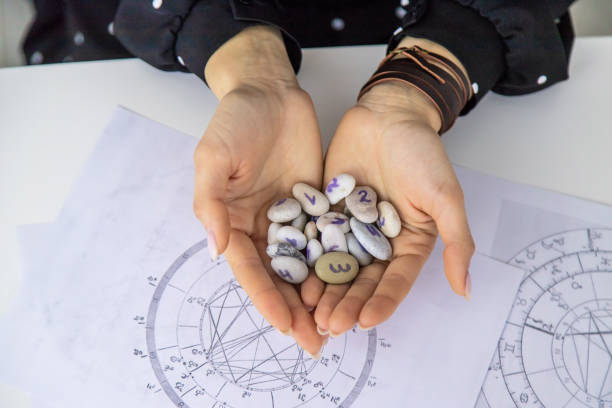 istock Woman numerologist astrologer counts numbers. Selective focus. 1455216134