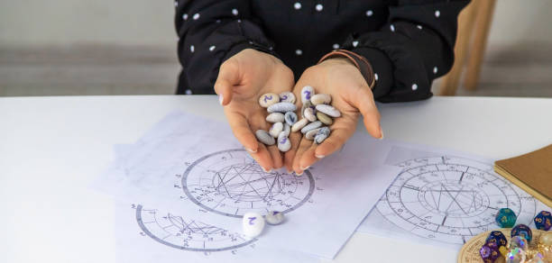 istock Woman numerologist astrologer counts numbers. Selective focus. 1455216136