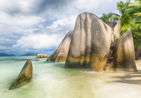 Anse Source d'Argent, La Digue Seychelles, a young couple of Caucasian men and women on a tropical beach during a luxury vacation