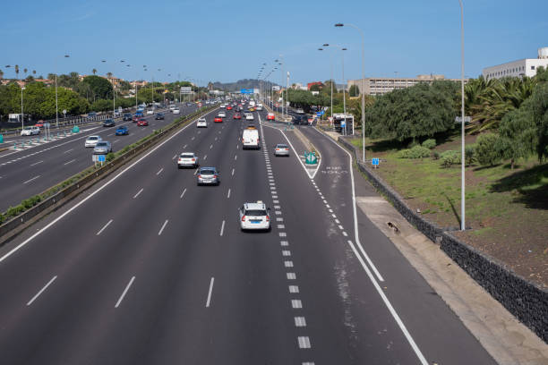 istock highway with midday traffic. Tenerife, Canary Islands, Spain 1455226537
