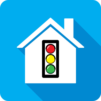 Vector illustration of a house with traffic light icon against a blue background in flat style.