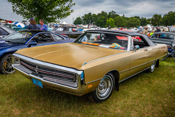 Iola, WI - July 07, 2022: High perspective front corner view of a 1969 Chrysler 300 Convertible at a local car show.