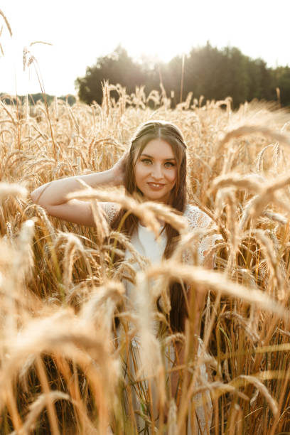 istock Happy female in agricultural field in sunlight 1455226842