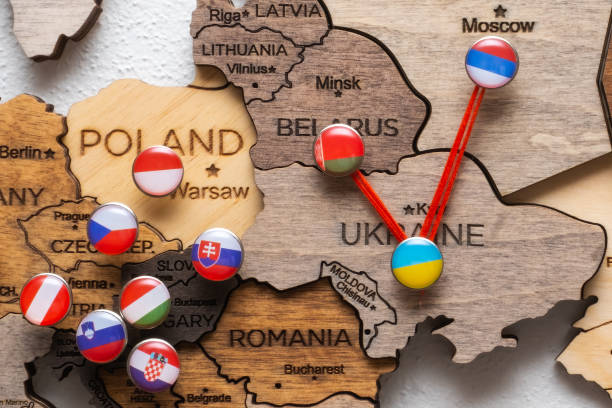istock Pins with flags and threads on the wooden maps demonstrate Russia and Belarus aggression in Ukraine 1455228225