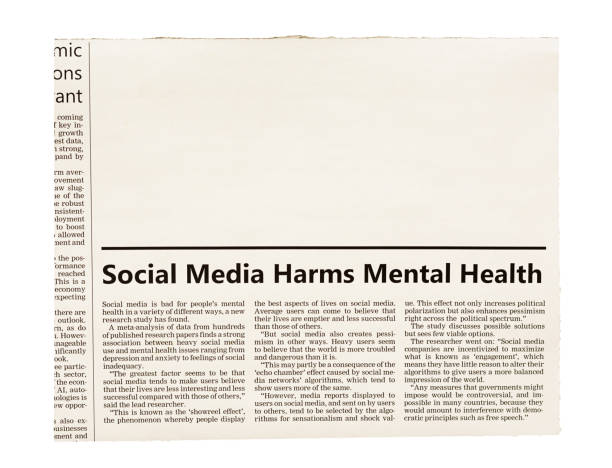 newspaper clipping with headline and article about social media harming mental health, with space for your copy - harming imagens e fotografias de stock