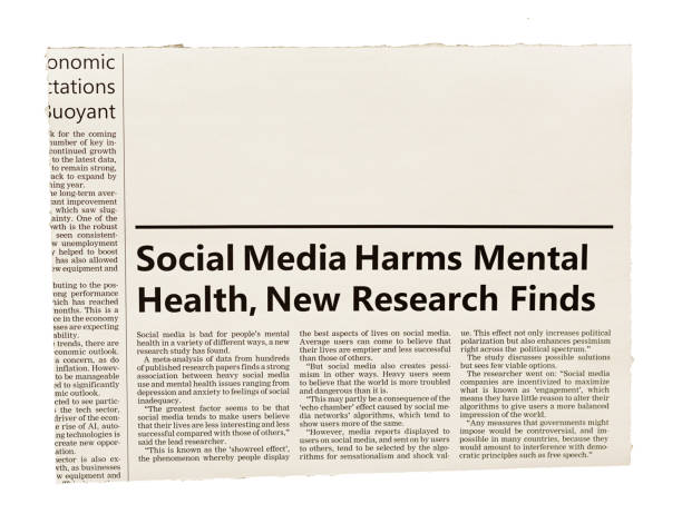 newspaper clipping with headline and article about social media harming mental health, with space for your copy - harming imagens e fotografias de stock
