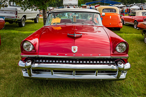 Iola, WI - July 07, 2022: High perspective front view of a 1955 Mercury Montclair Hardtop Coupe at a local car show.