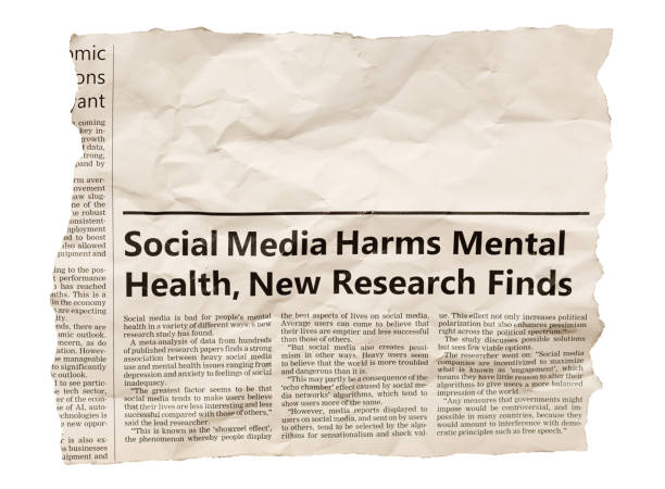 Newspaper clipping with headline and article about social media harming mental health, with space for your copy stock photo