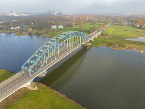 IJsselbrug or Katerveerbrug bridge over the river IJssel near the city of Zwolle in Overijssel, The Netherlands. Aerial drone point of view.