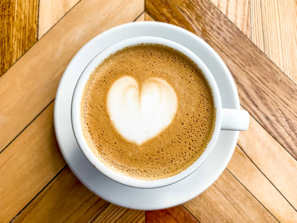 istock A cup of coffee latte on a wooden table 1455233920