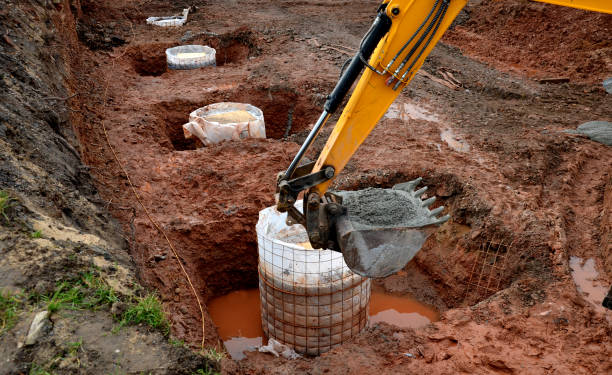 fundamentowanie budynków za pomocą wierconych pali dla domów prywatnych, a także dla budynków przemysłowych. studnię wykonano bez obudowy lub pod stalową kratą ochronną, geowłókniną - drilled zdjęcia i obrazy z banku zdjęć