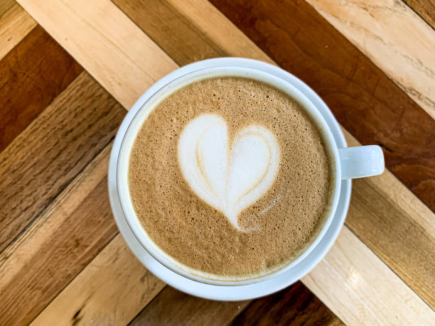 istock A cup of coffee latte on a wooden table 1455234229