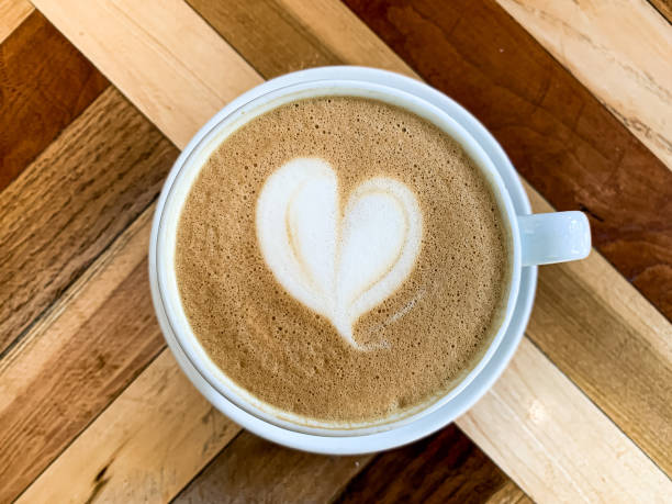 istock A cup of coffee latte on a wooden table 1455234360