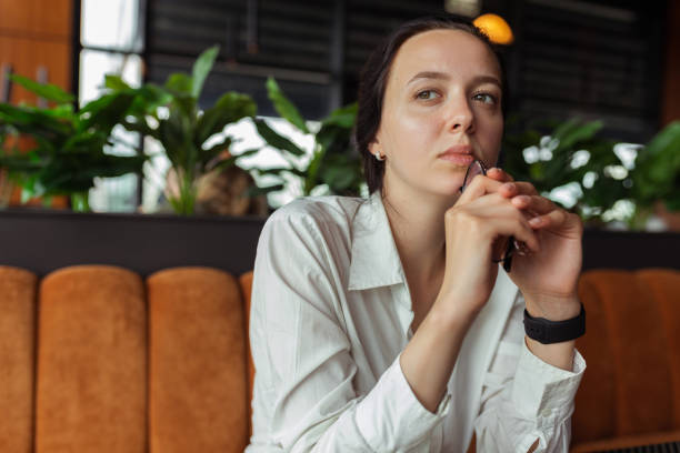 istock Thoughtful businesswoman at table in cafe 1455234505