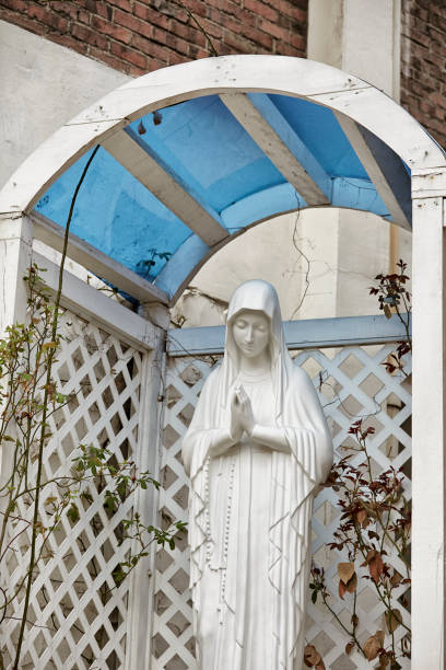 istock Old garden praying Virgin Mary statue, 1455235711