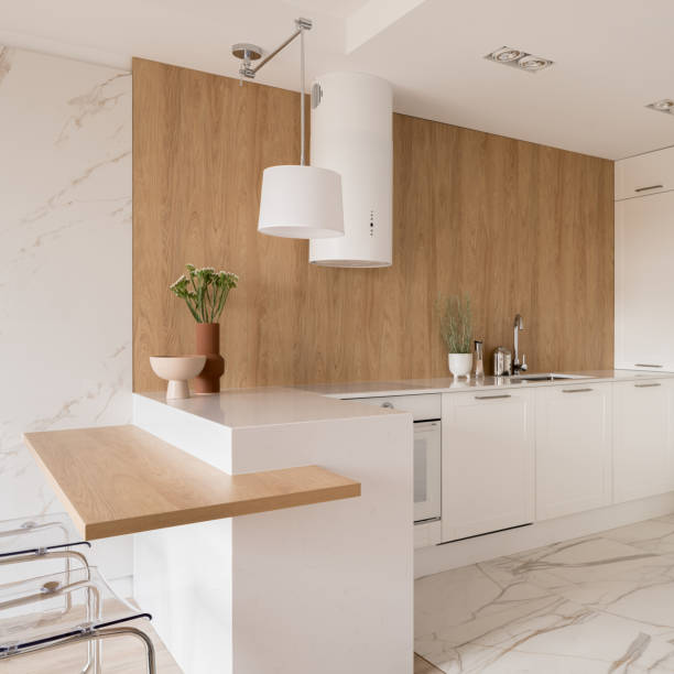 istock Fashionable kitchen with wooden wall 1455236066
