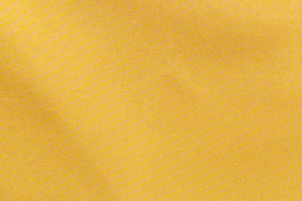 istock Yellow color fabric cloth polyester texture and textile background. 1455237637
