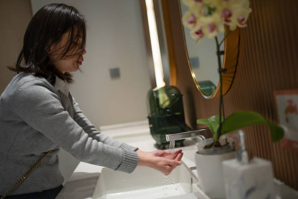 istock Asian woman is washing hands 1455237775
