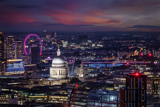Elevated view of the skyline of London with St. Pauls Cathedral, river Thames and Big Ben tower in the background