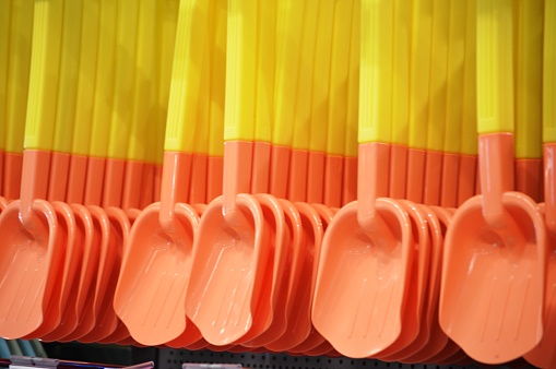 sale of construction shovels on the rack in the store