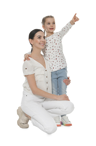 Little girl with her mother on white background